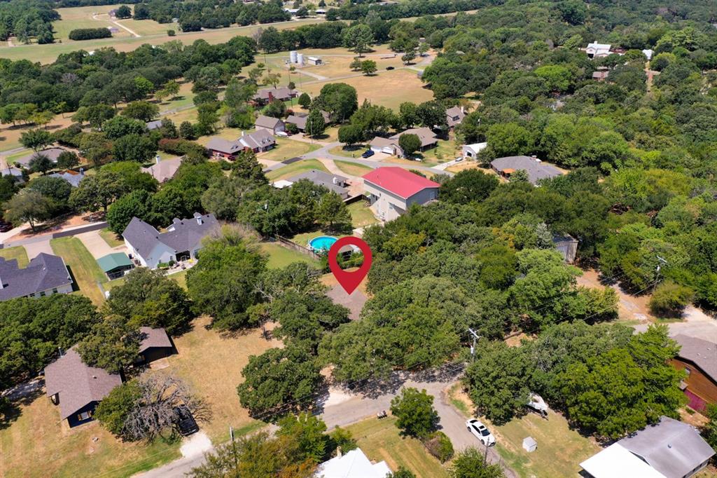 an aerial view of residential house with outdoor space and swimming pool