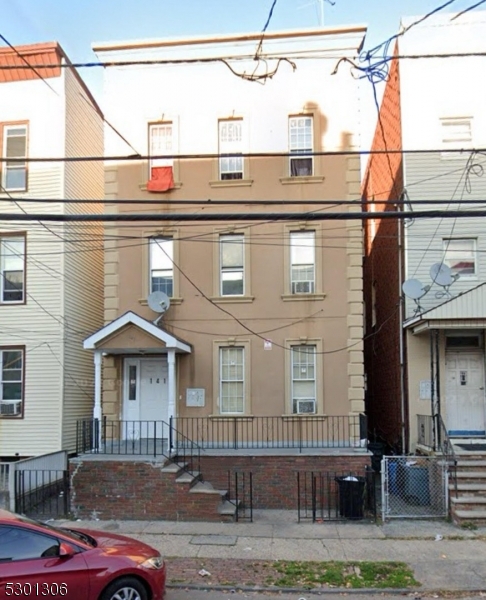 a front view of a house with garage