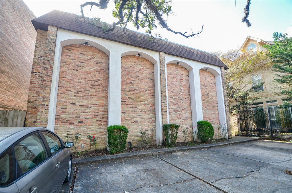 a front view of a building with potted plants