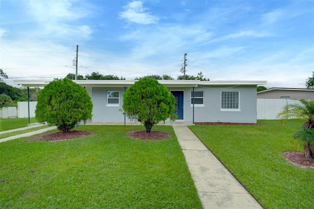 a front view of a house with garden