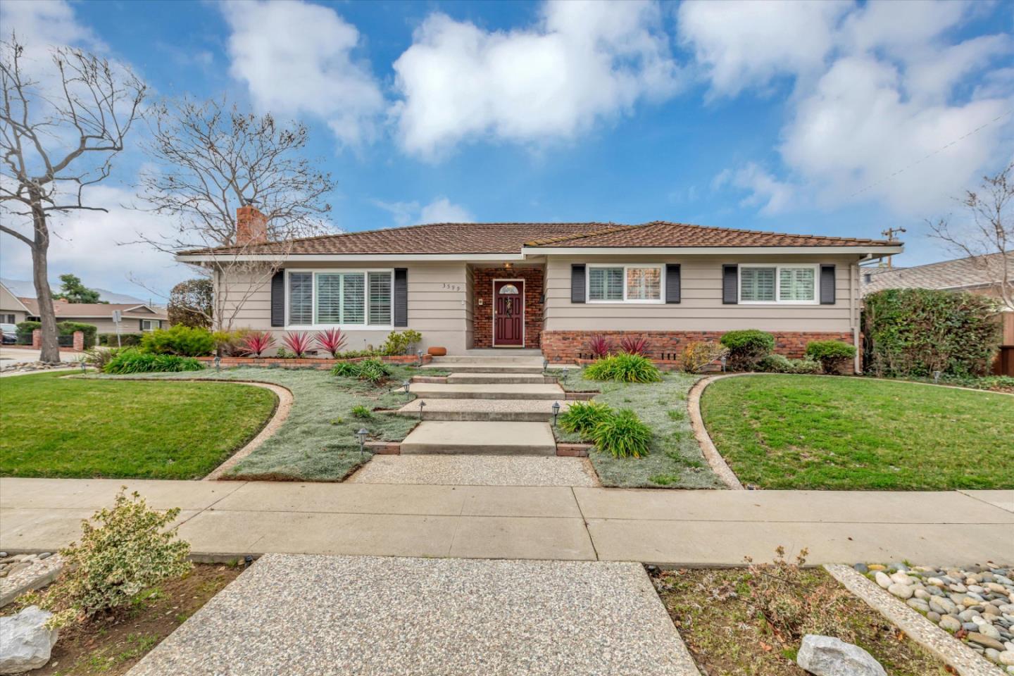 front view of a house with a yard