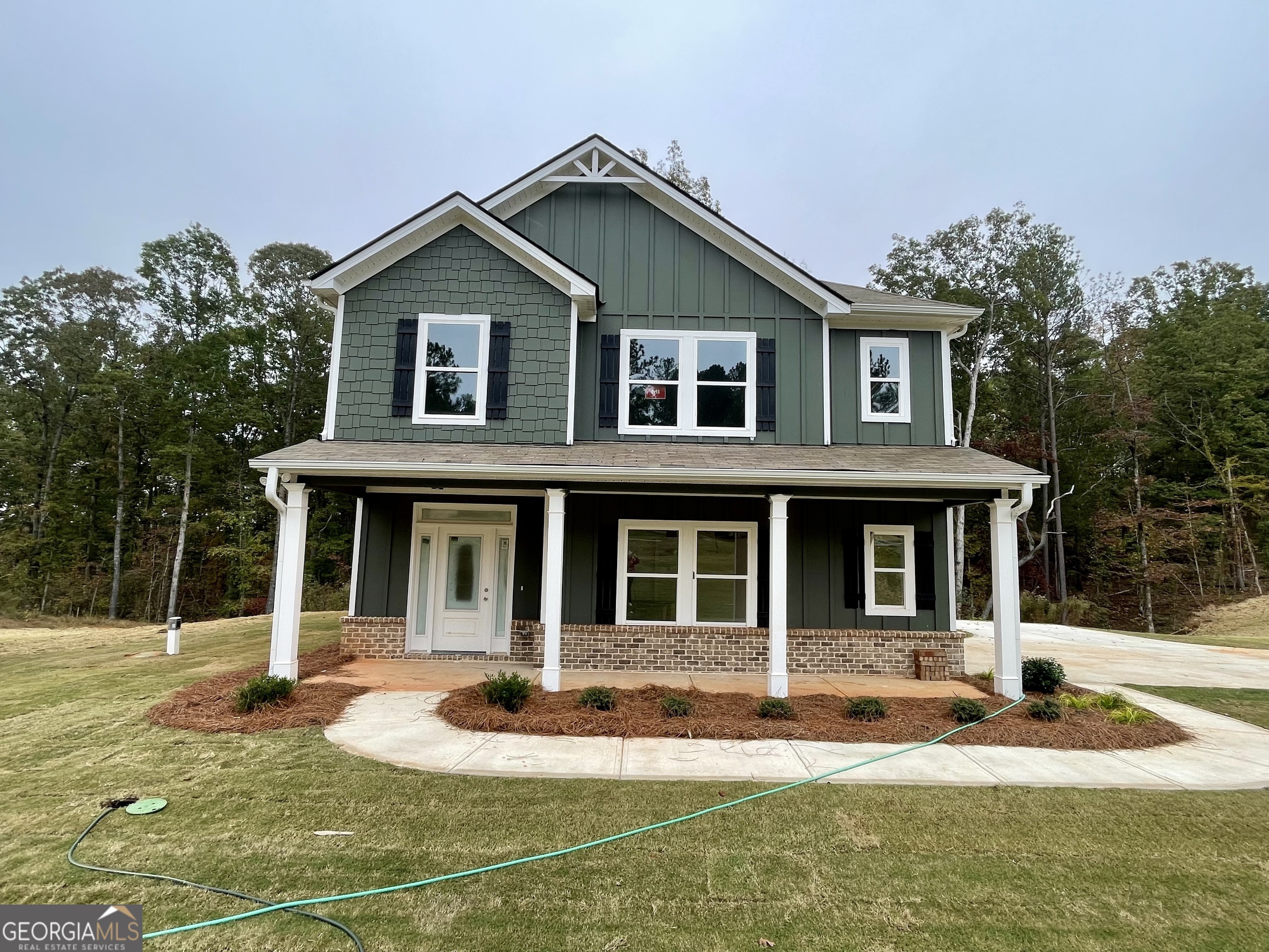 a front view of a house with garage