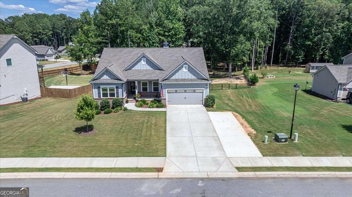 a front view of a house with garden