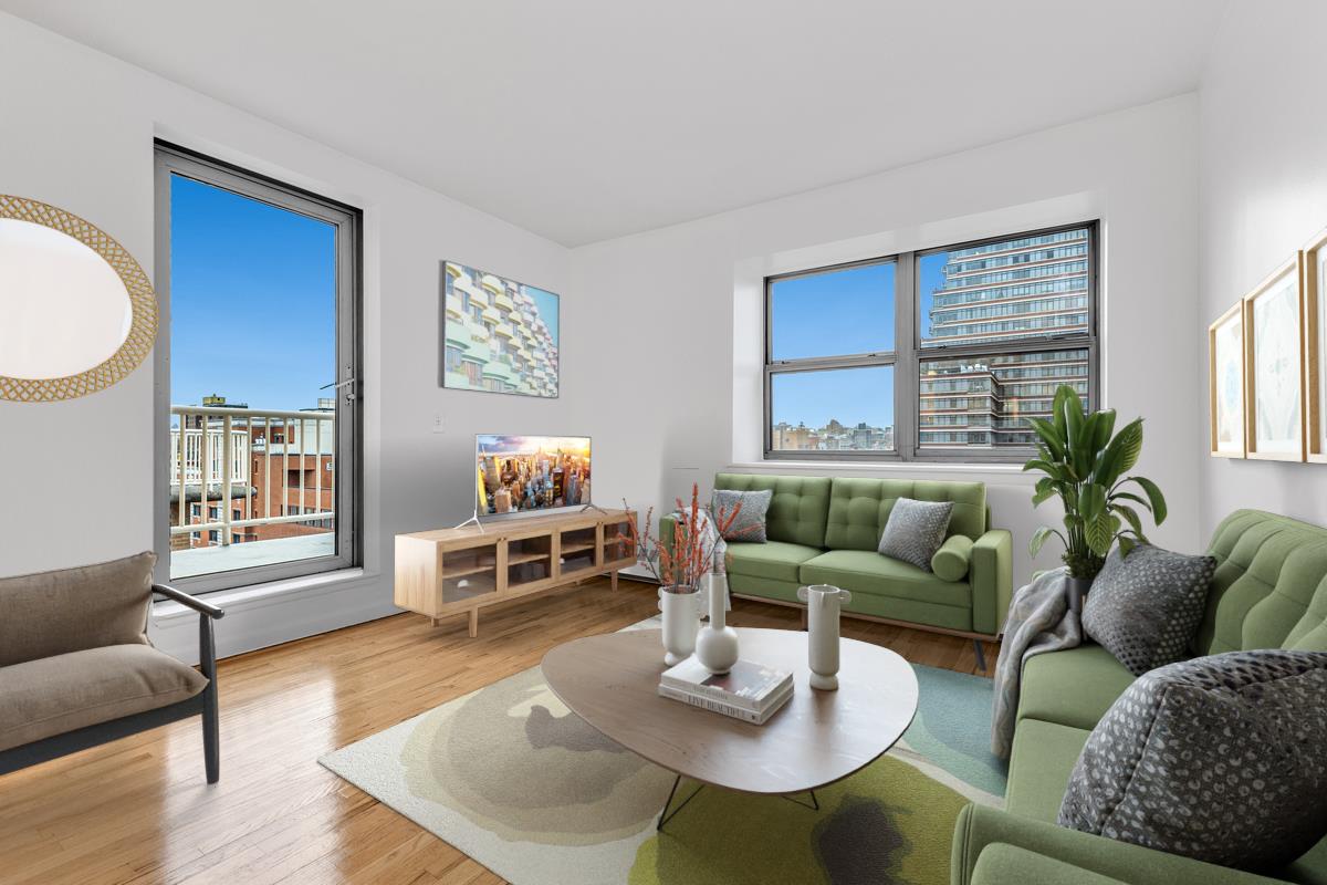 a living room with furniture a wooden floor and a window