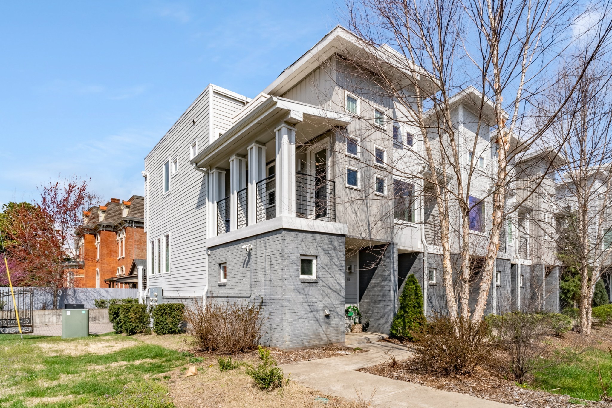 a front view of a house with garden