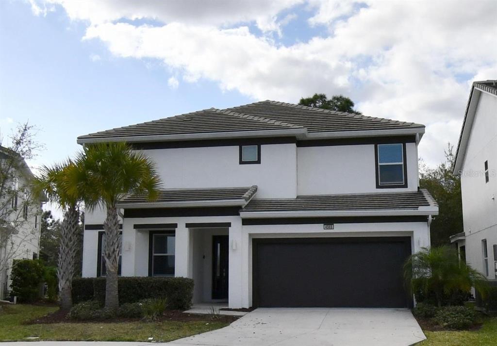 a front view of a house with a garage