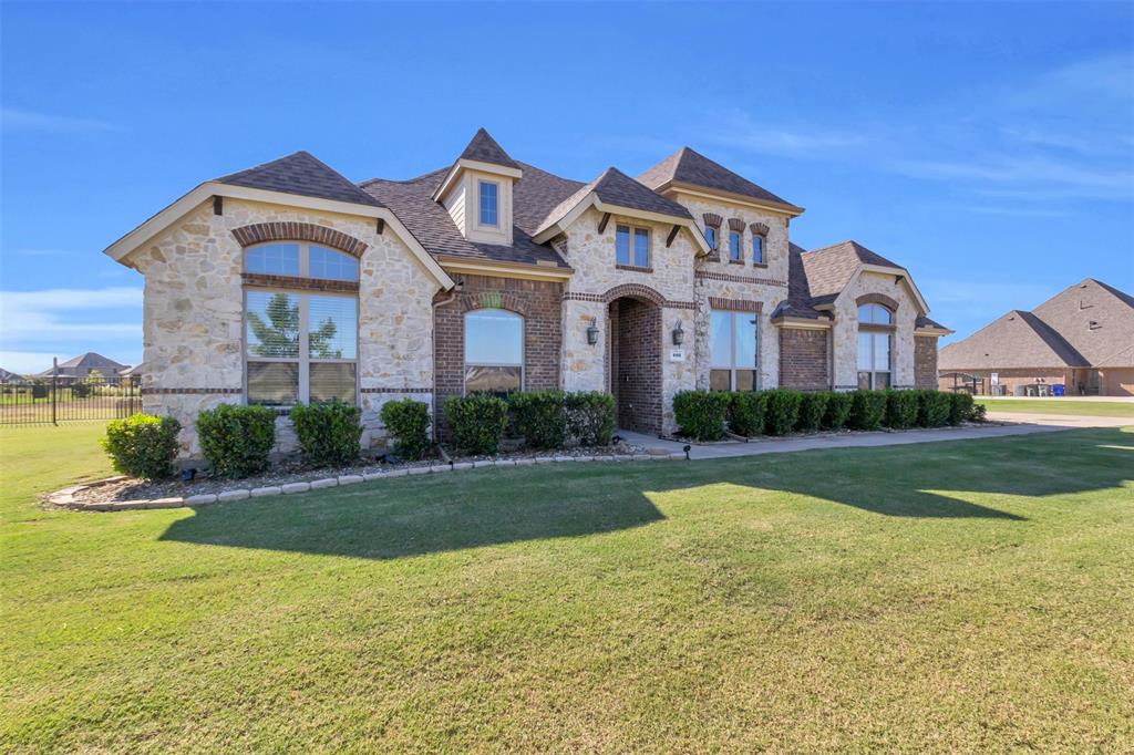 a front view of house with yard and green space