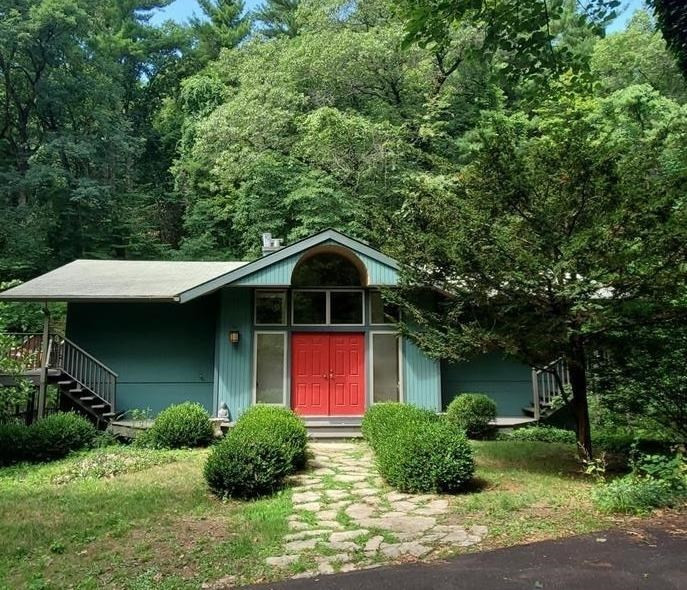 a front view of a house with a yard