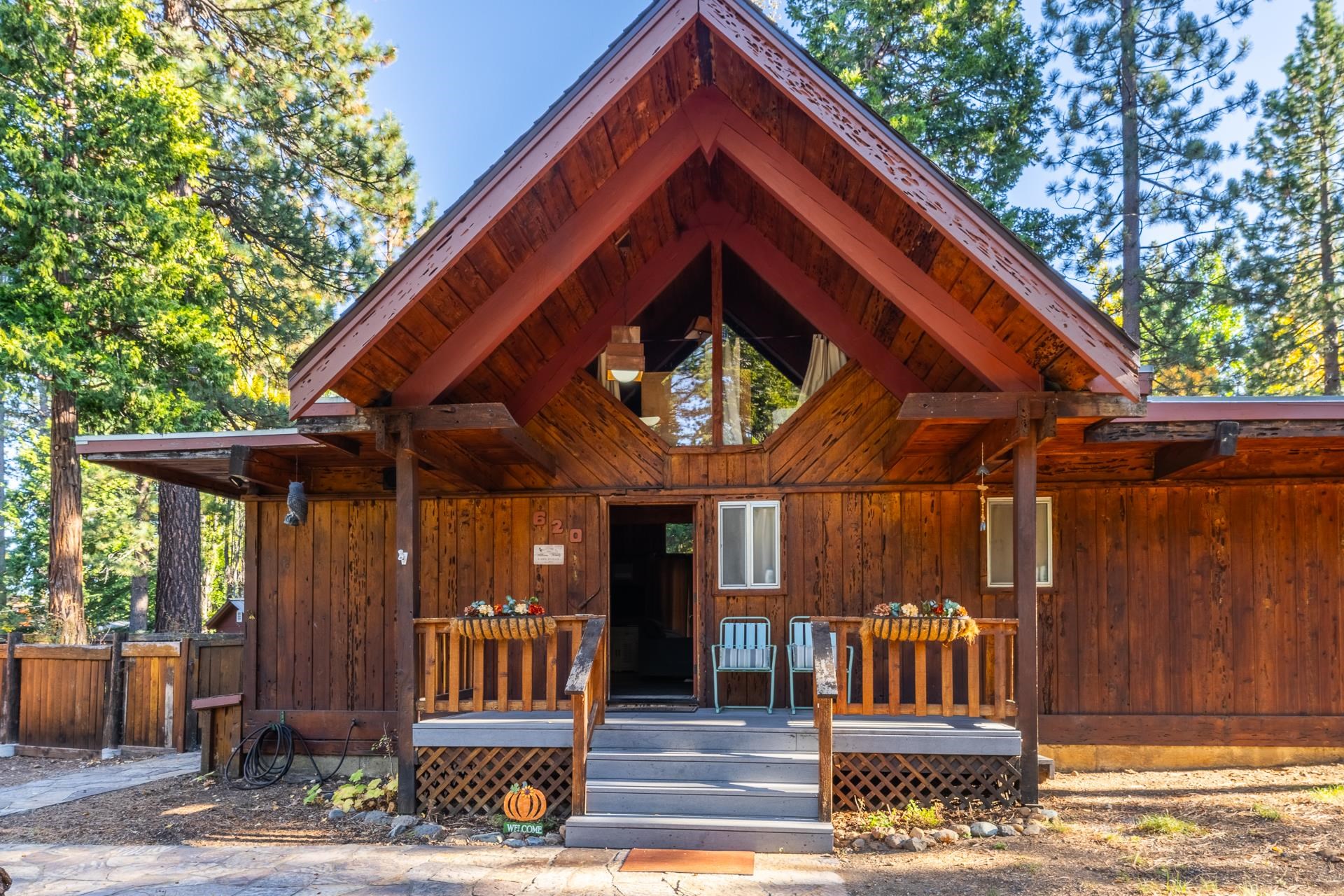 a view of a house with a patio and wooden floor