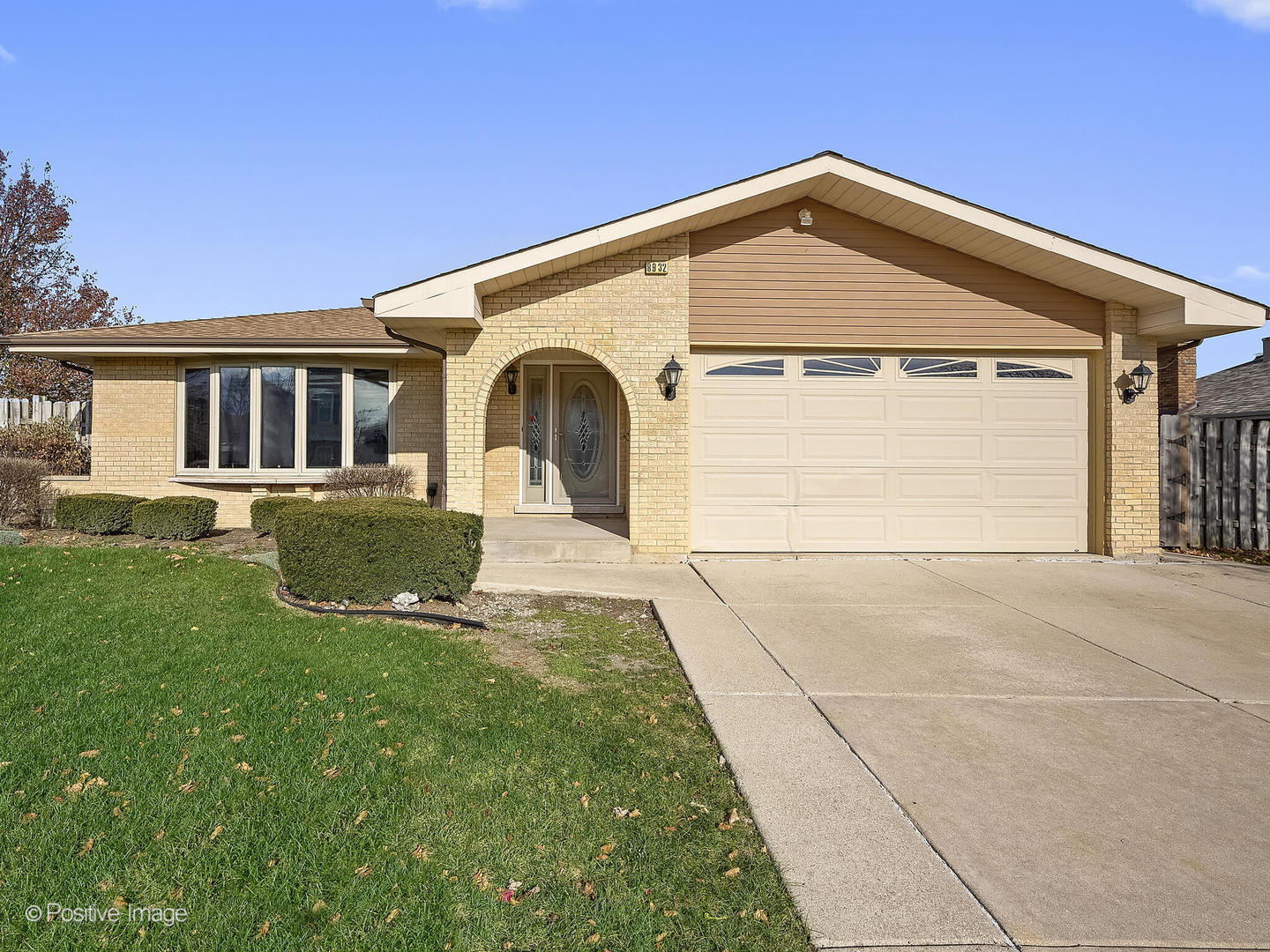 a front view of a house with yard