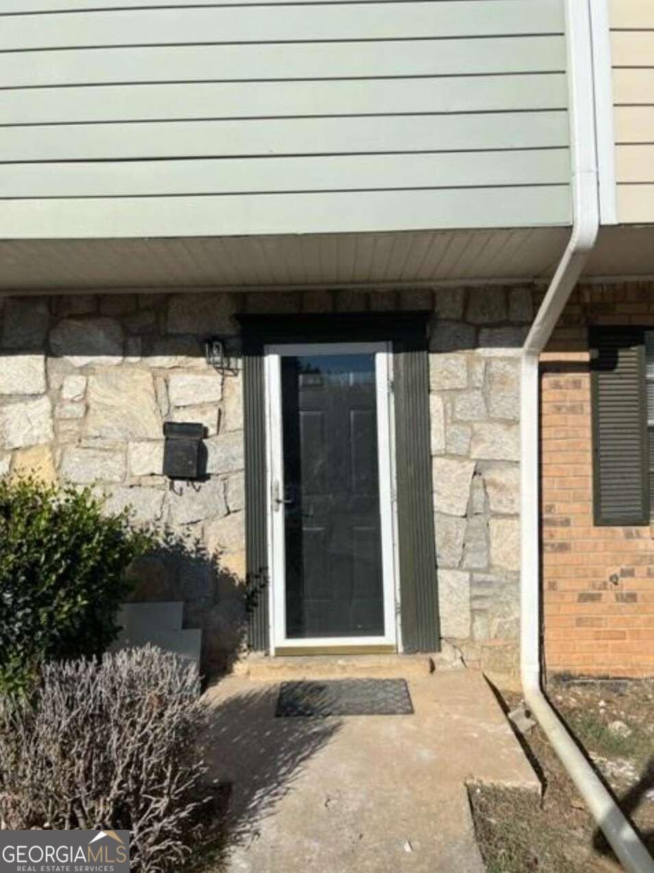 a front view of a house with a garage