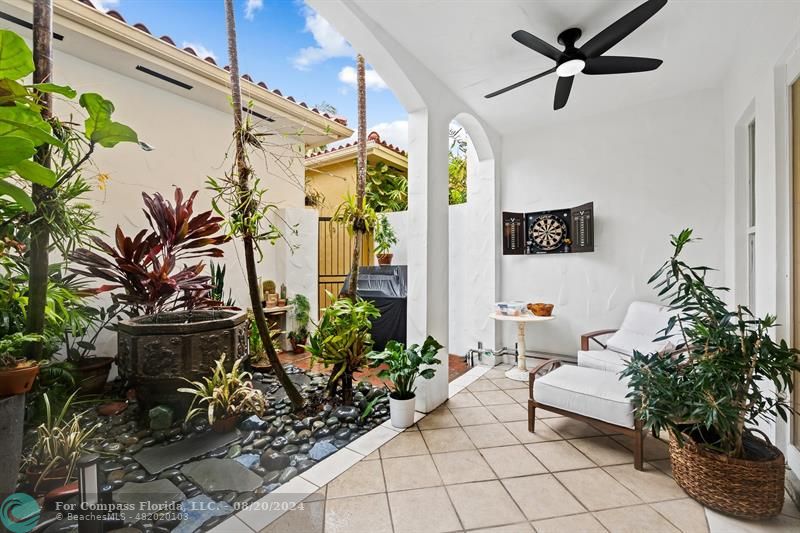 a living room with patio furniture