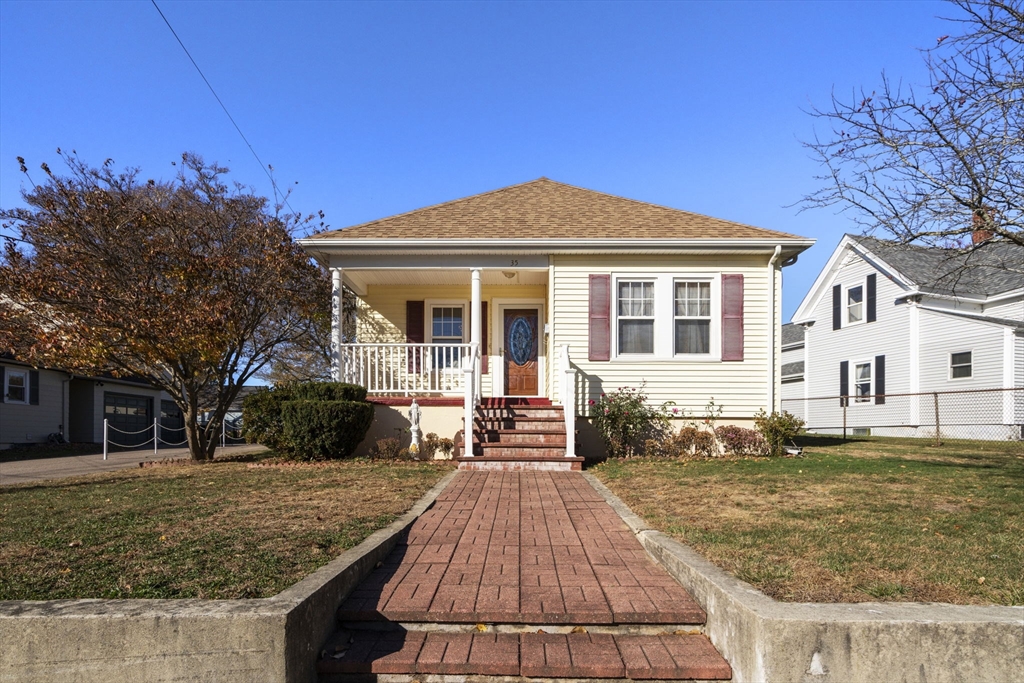 a front view of a house with garden