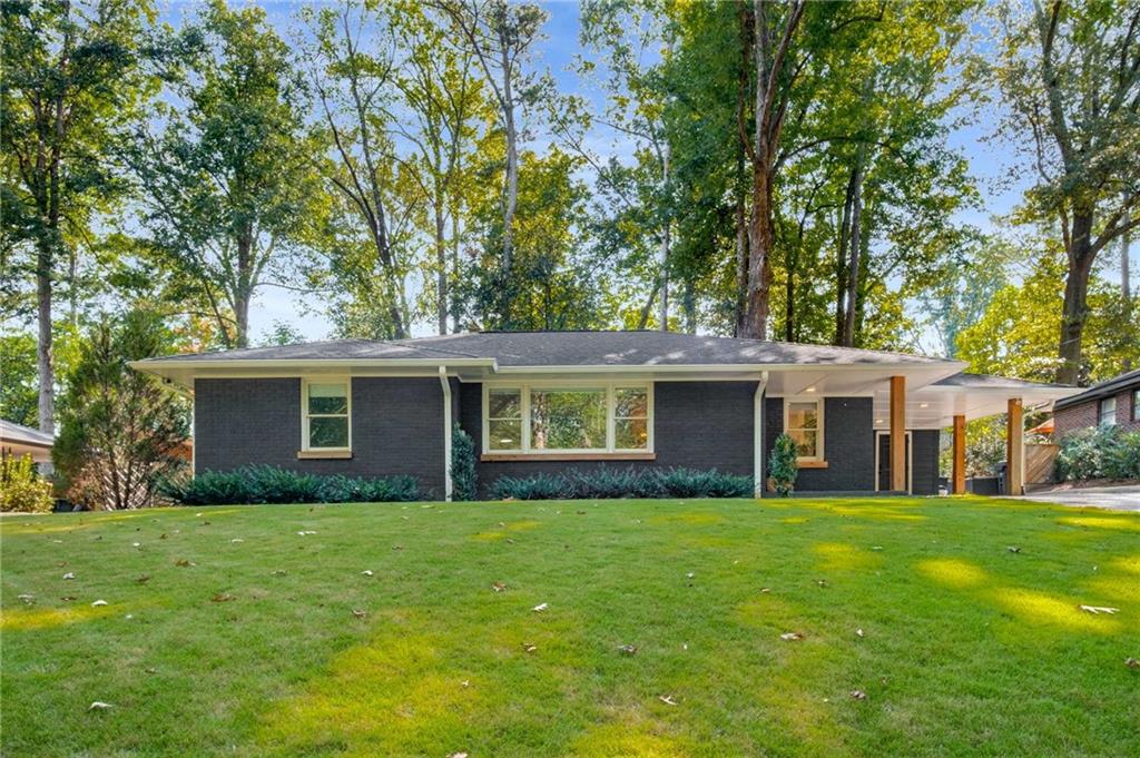 a house that is sitting in the grass