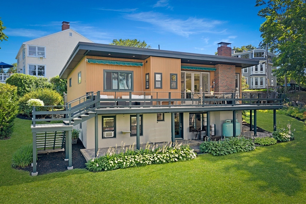 front view of a house with a garden