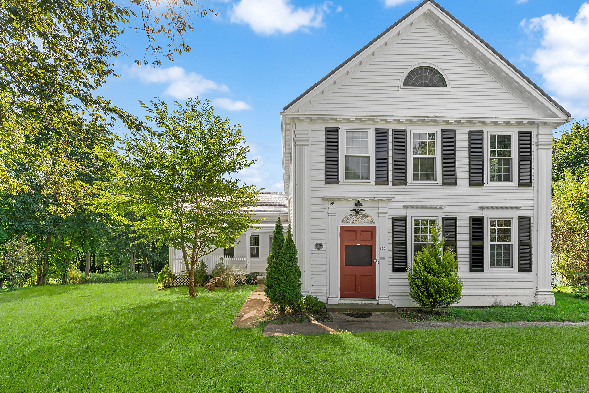 front view of a house with a yard