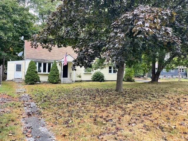 a front view of a house with a yard