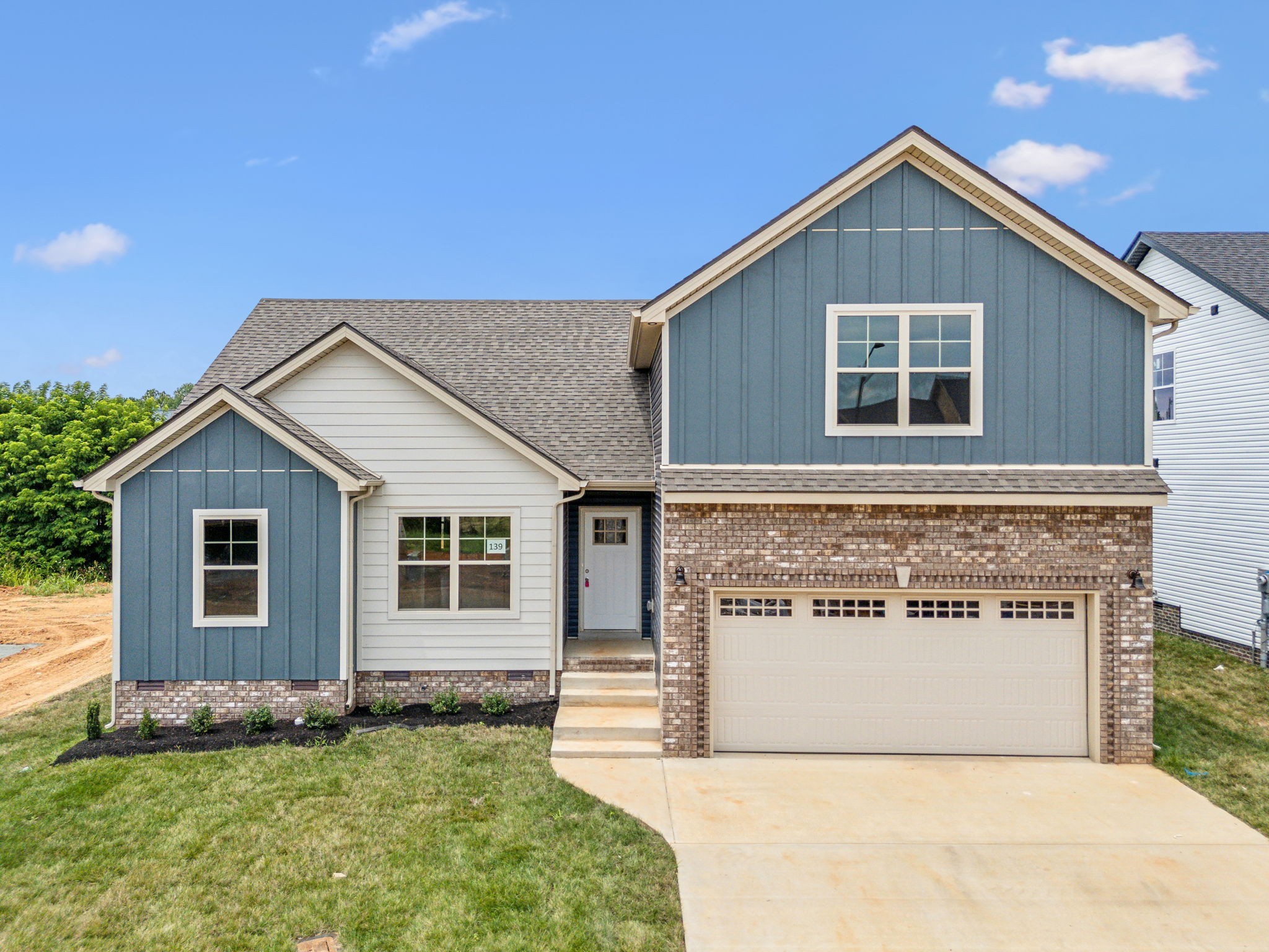 a view of front of house with a yard