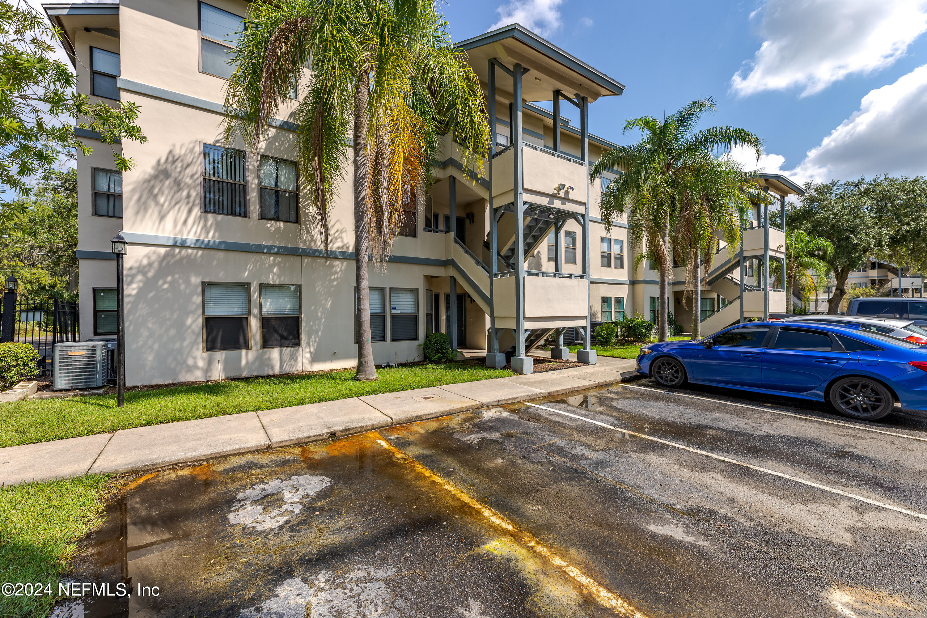 a car parked in front of a brick house