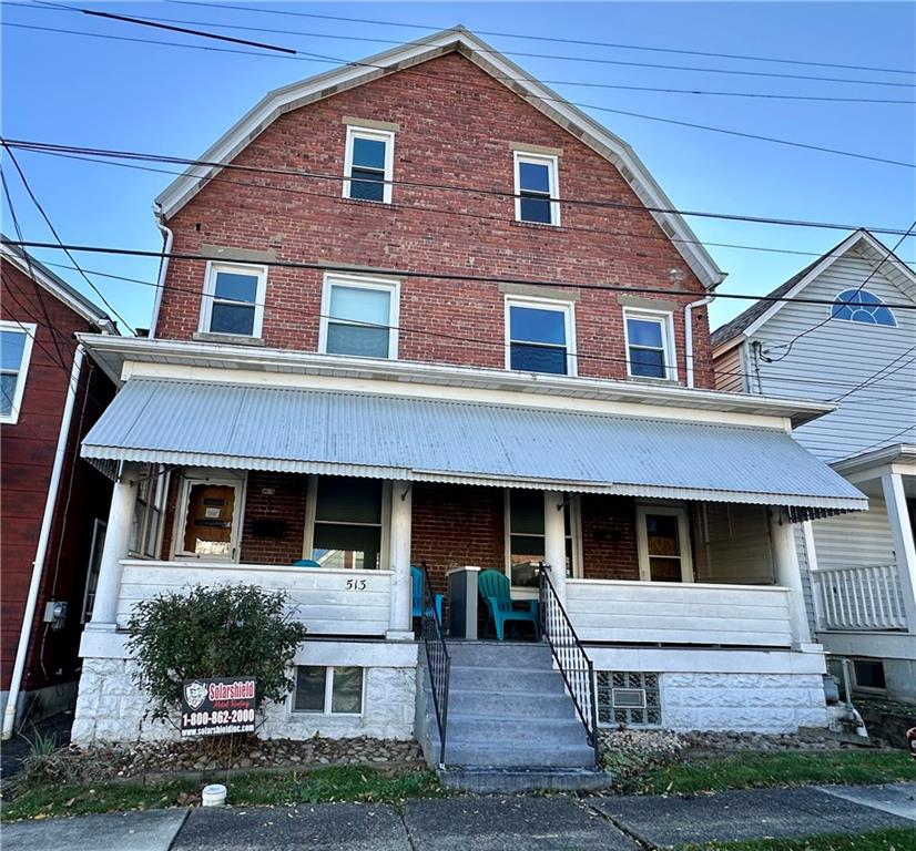 a front view of a house with yard