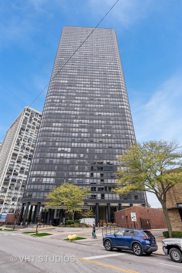 a front view of a building with parking space