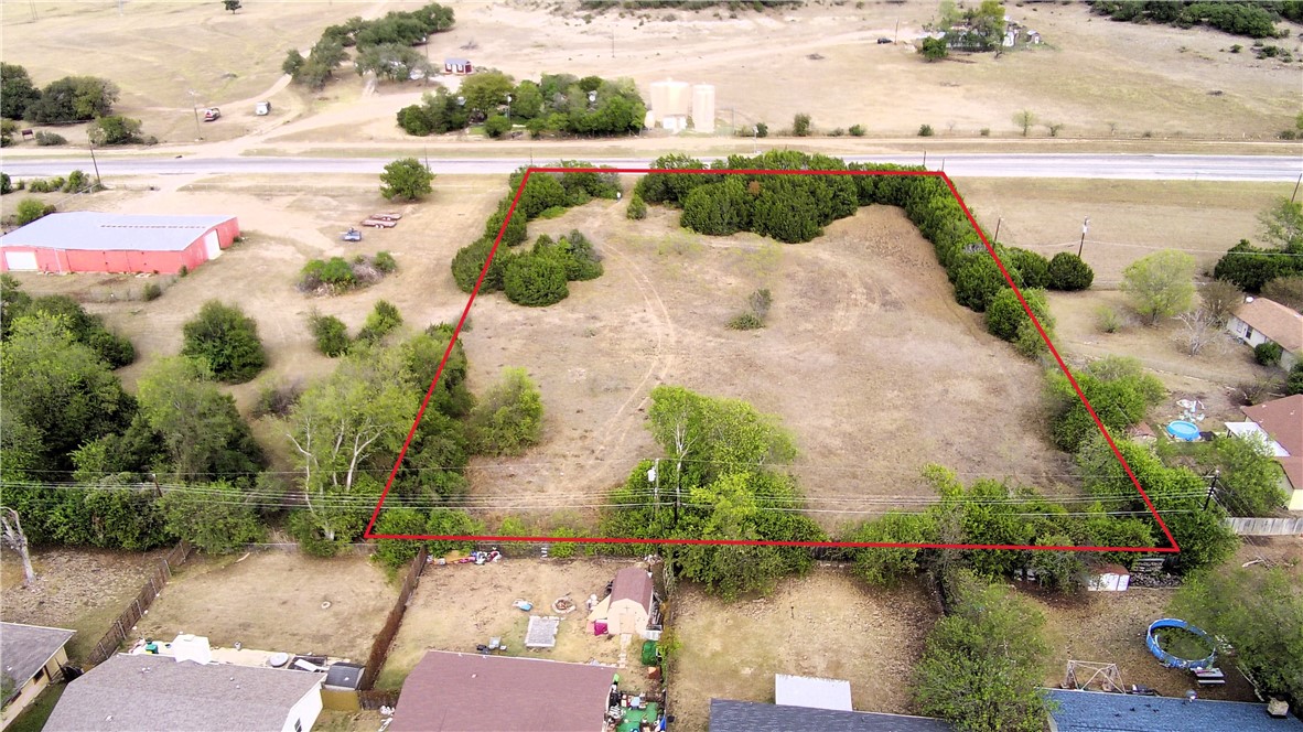 an aerial view of lake residential house with swimming pool