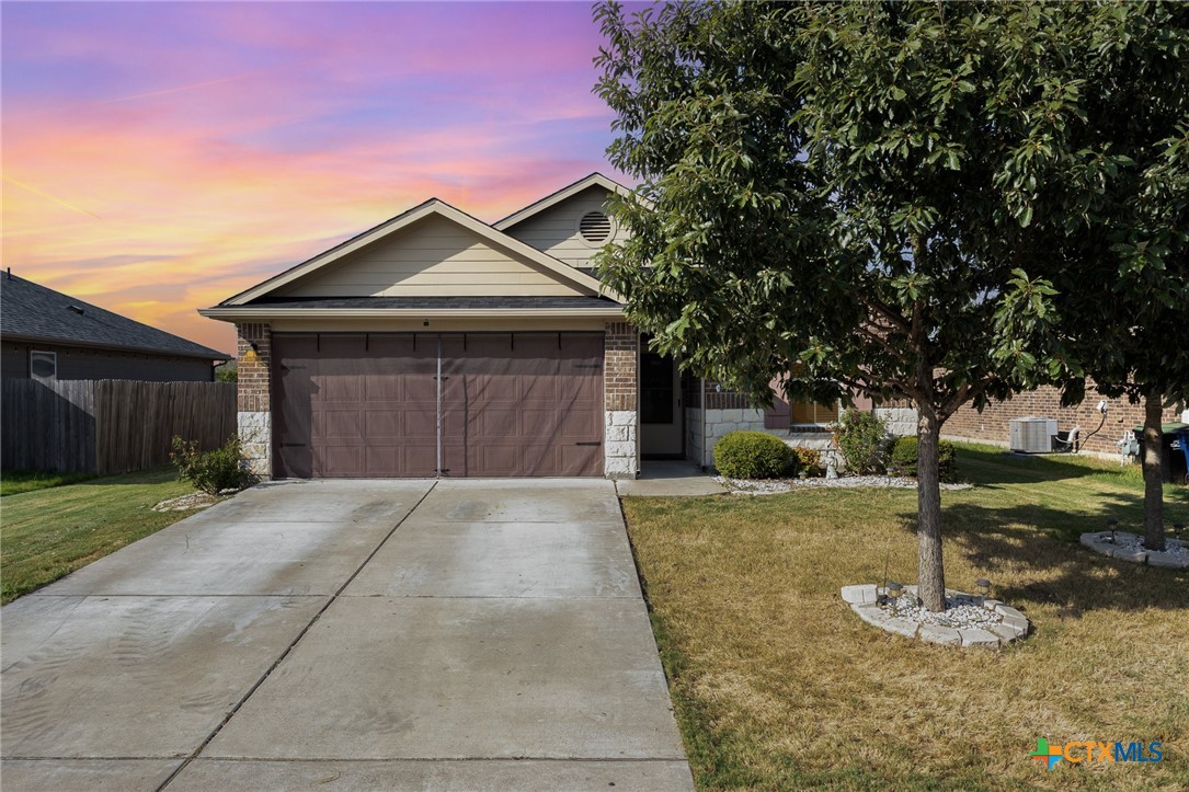 a front view of a house with yard