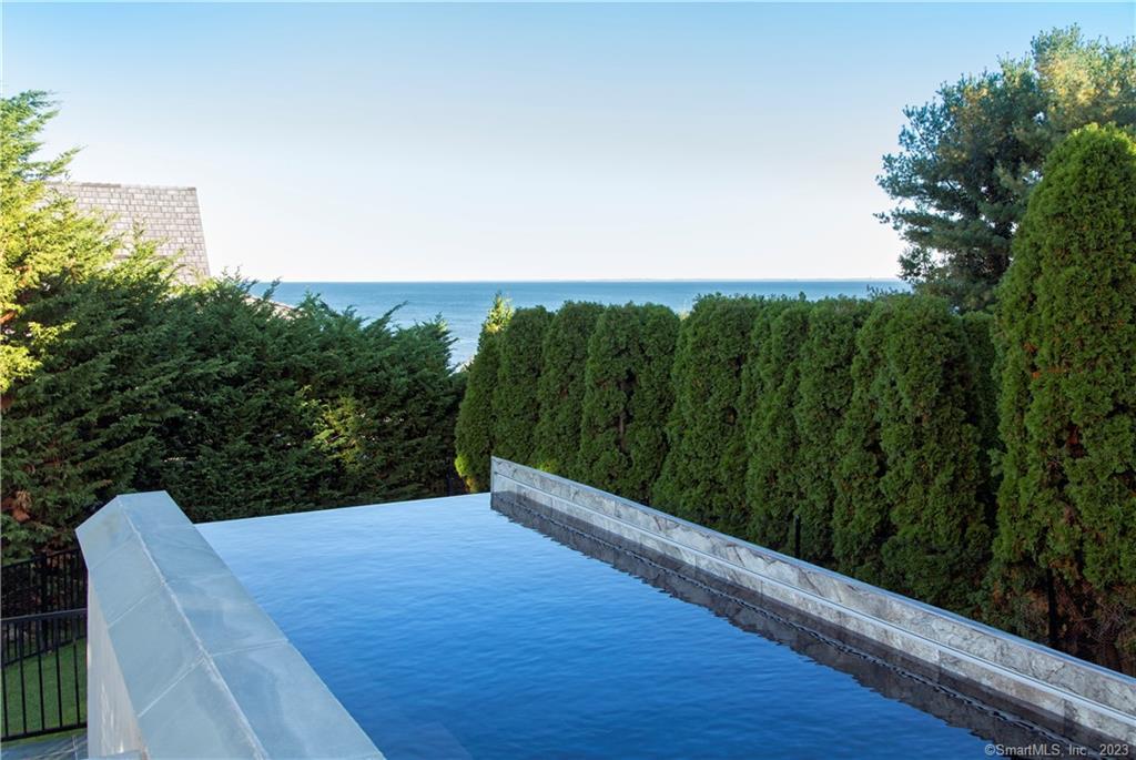 a view of a balcony with an outdoor seating