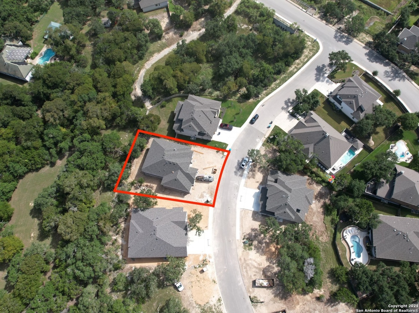 an aerial view of house with yard swimming pool and outdoor seating