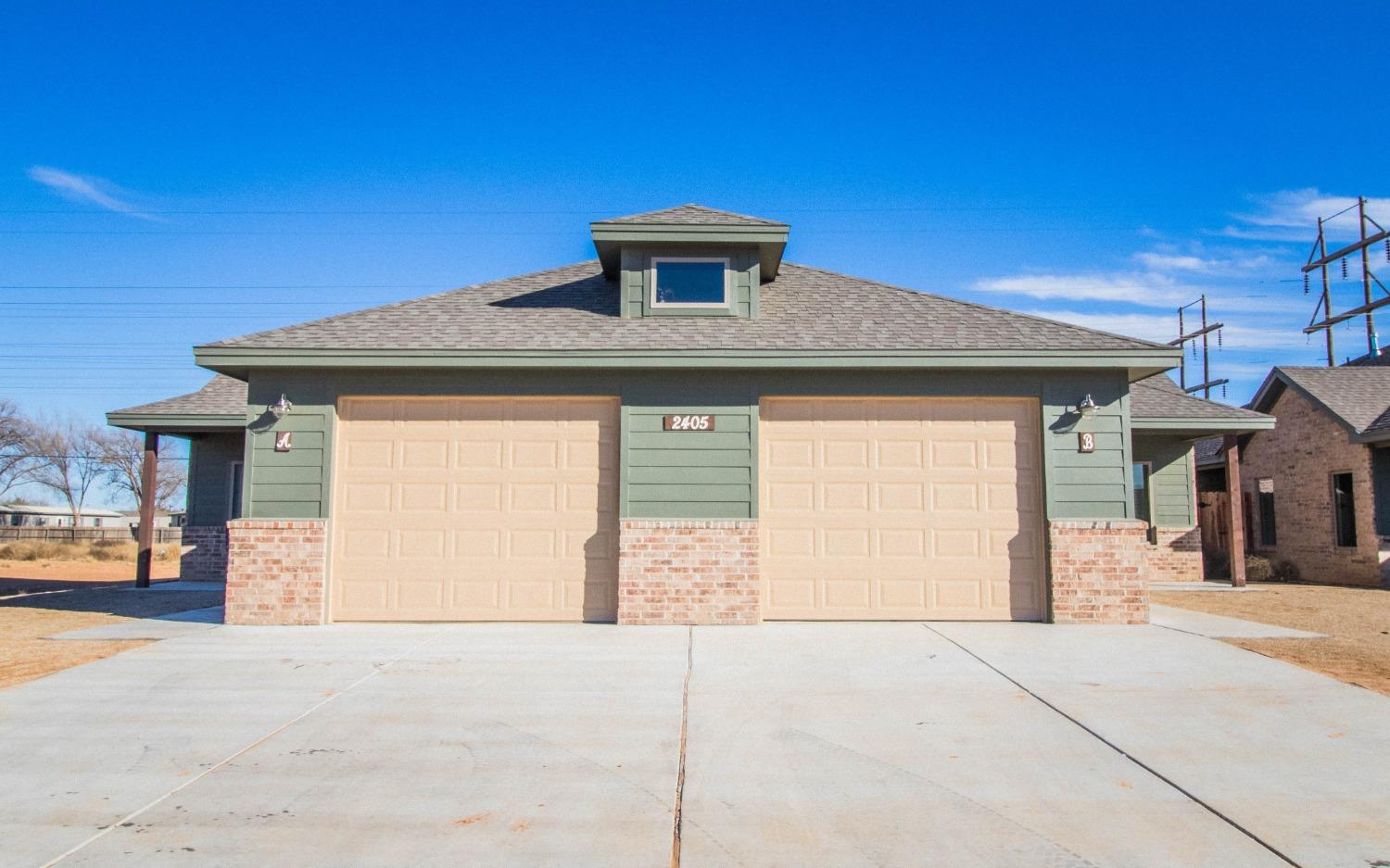 a front view of a house with a garage