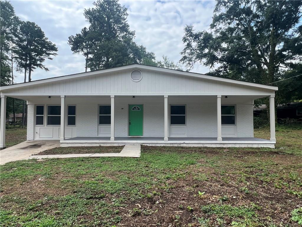 front view of a house with a yard