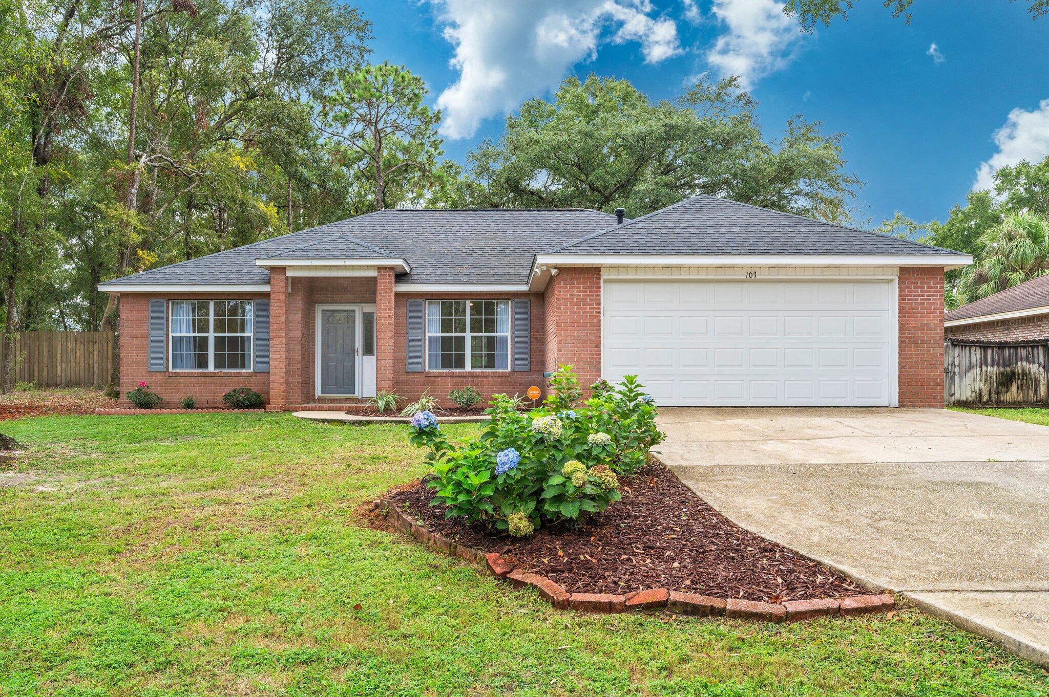 front view of a house with a yard