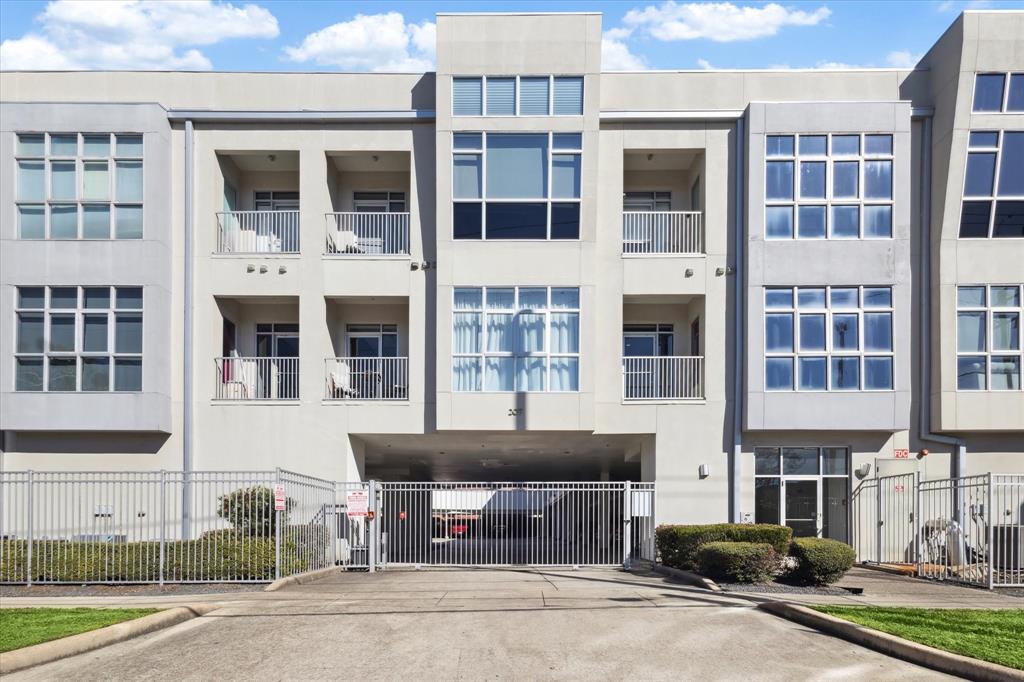 a front view of a building with a parking space