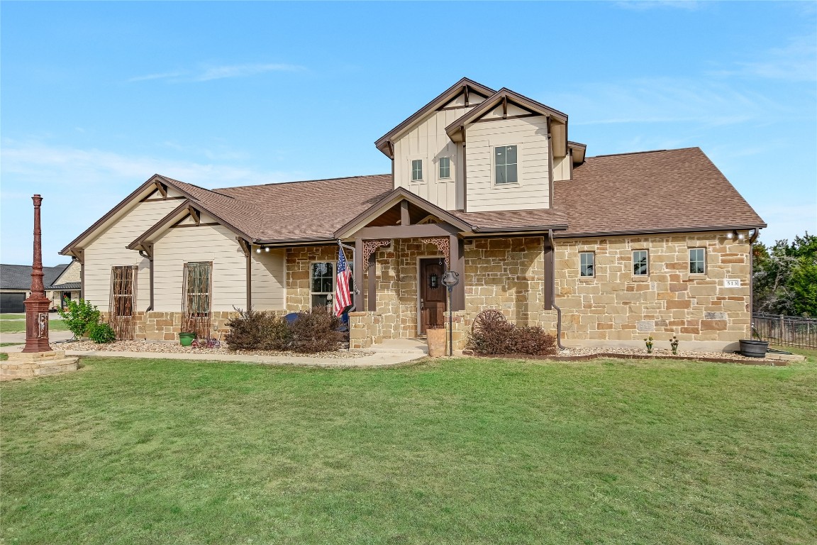 a front view of a house with a yard and porch