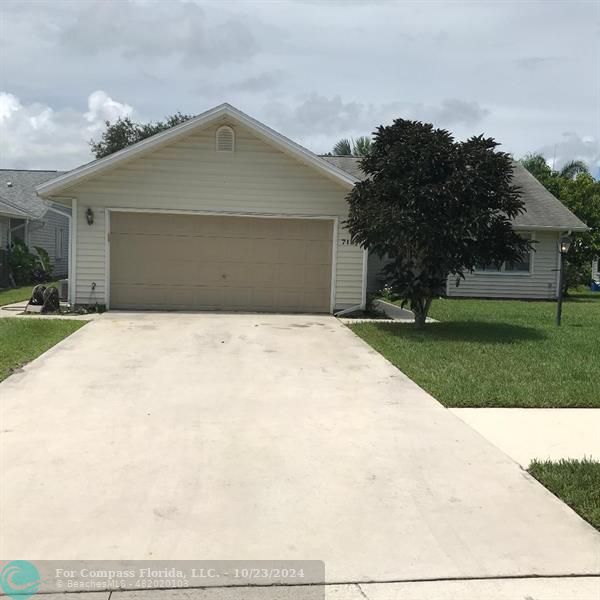 a front view of a house with yard