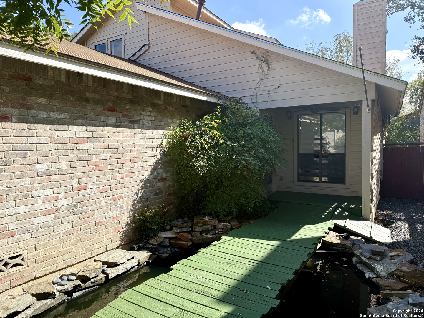 a backyard of a house with lots of green space