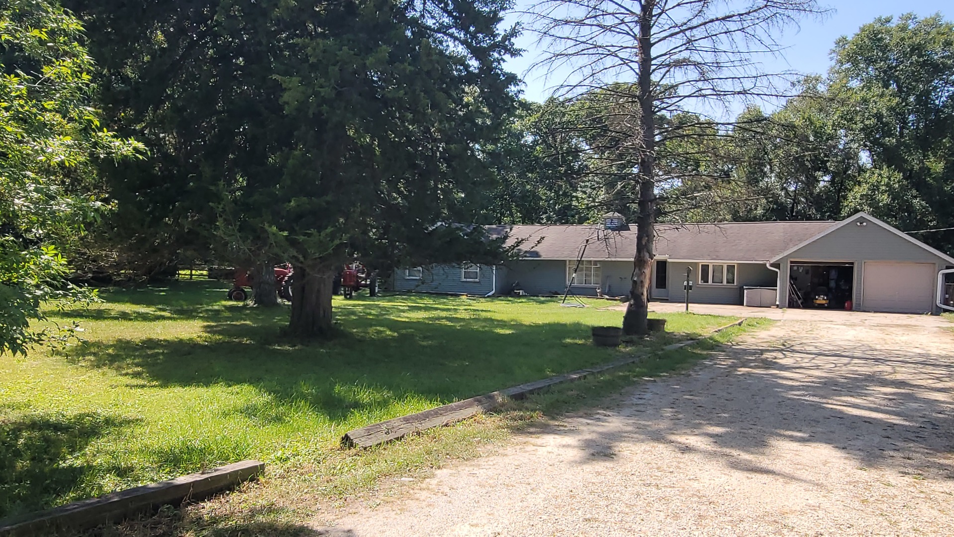 a view of a house with swimming pool and a yard