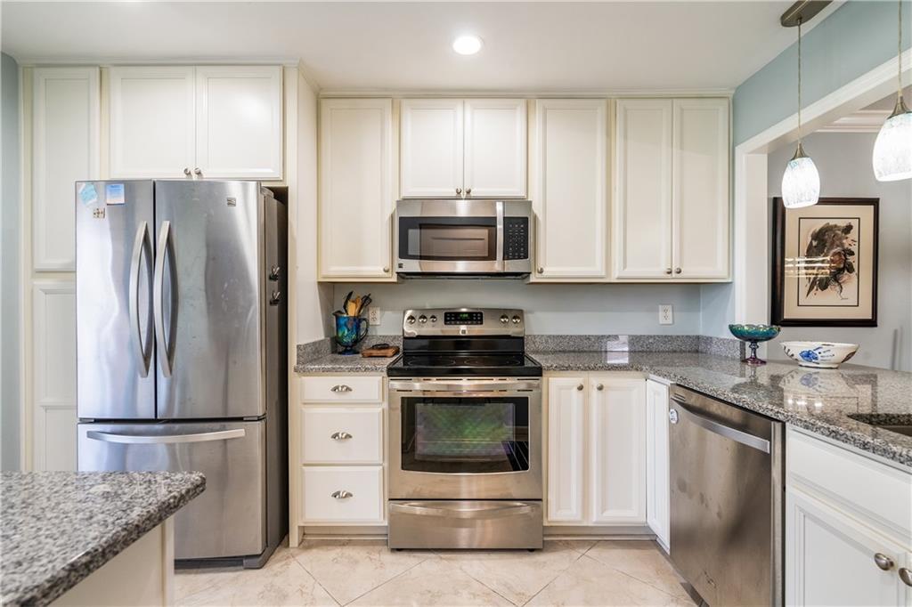 a kitchen with a stove microwave and refrigerator