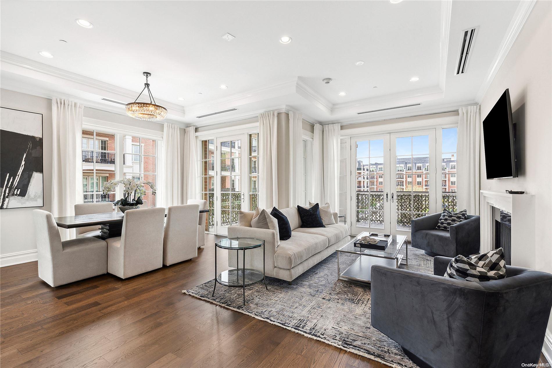 a living room with fireplace furniture and a flat screen tv