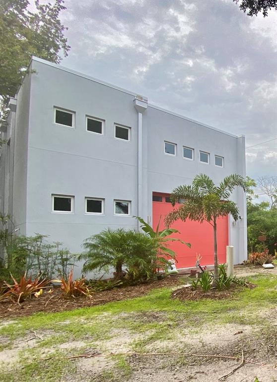 a front view of house with yard and swimming pool