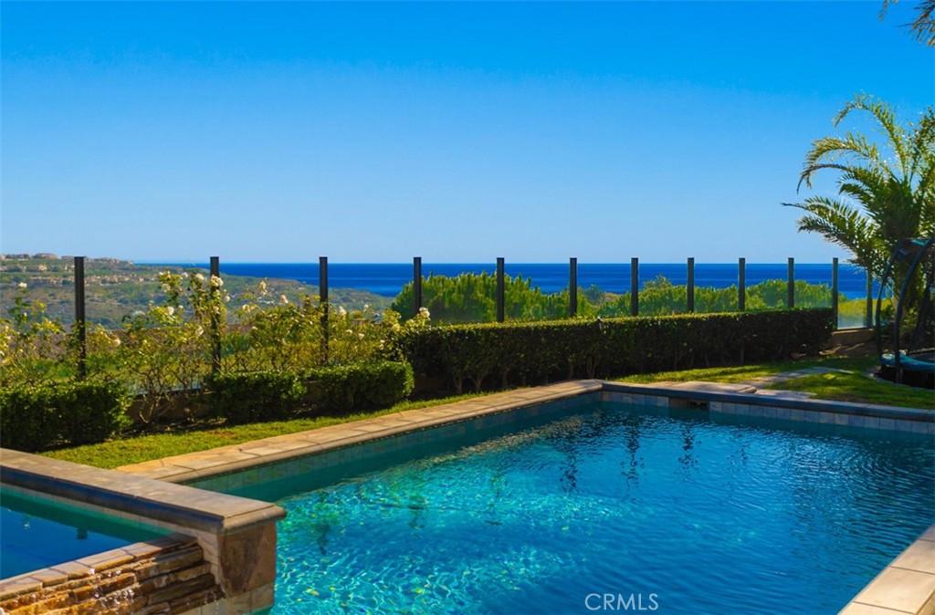 a view of a swimming pool with a yard