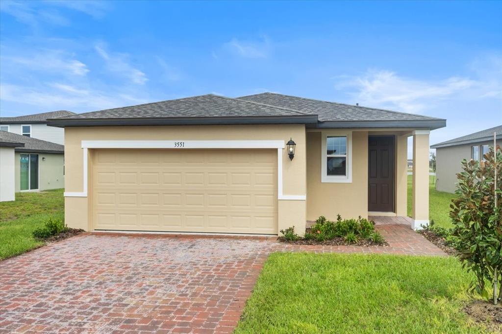 front view of a house and a yard