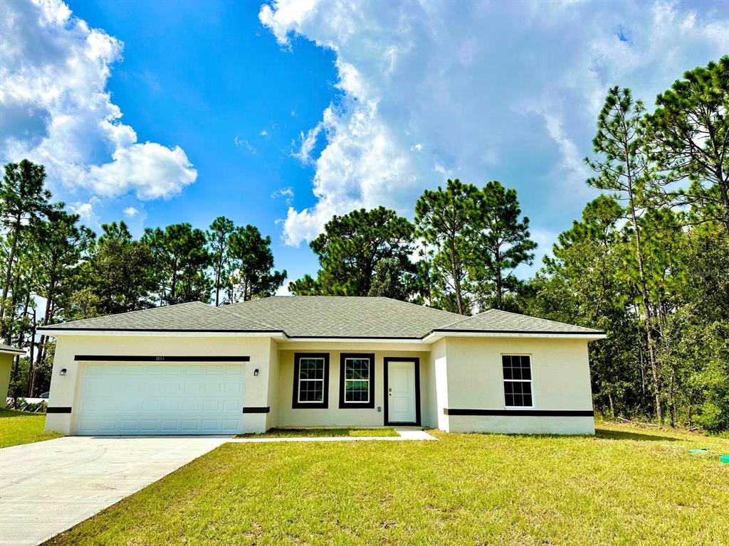 front view of a house with a yard