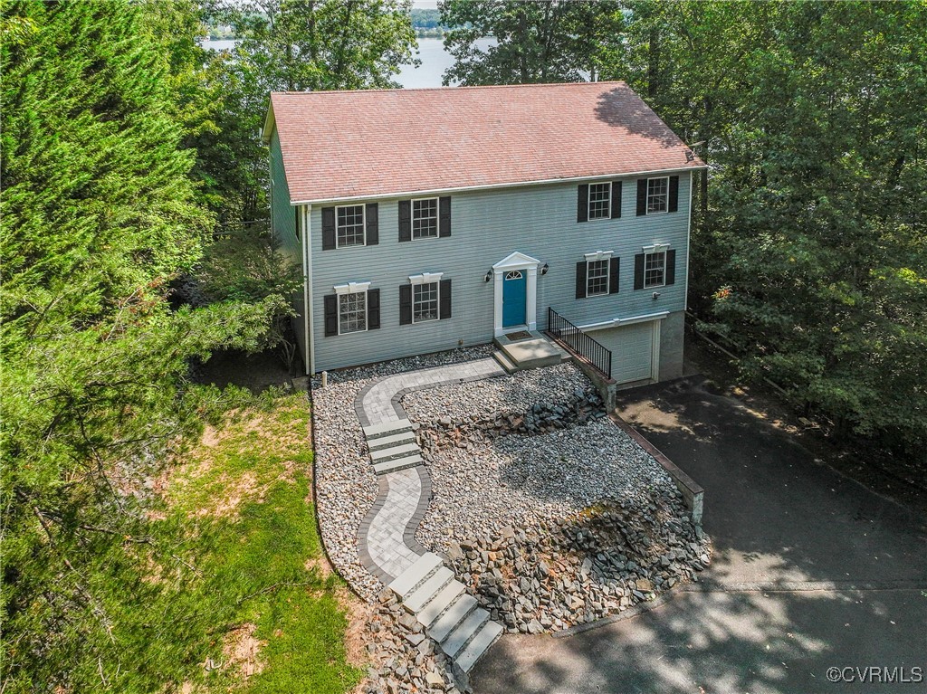 a aerial view of a house with a yard