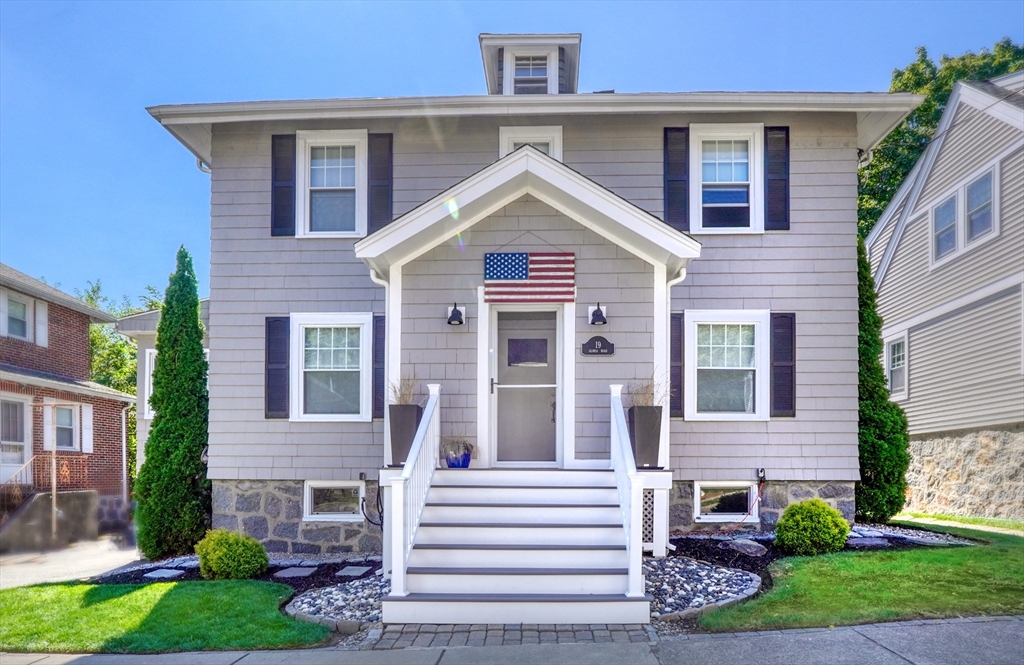 a view of a house with a yard and plants