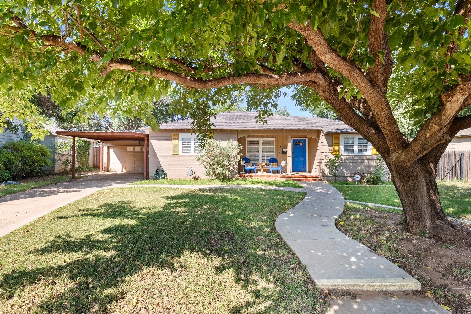 front view of a house with a yard