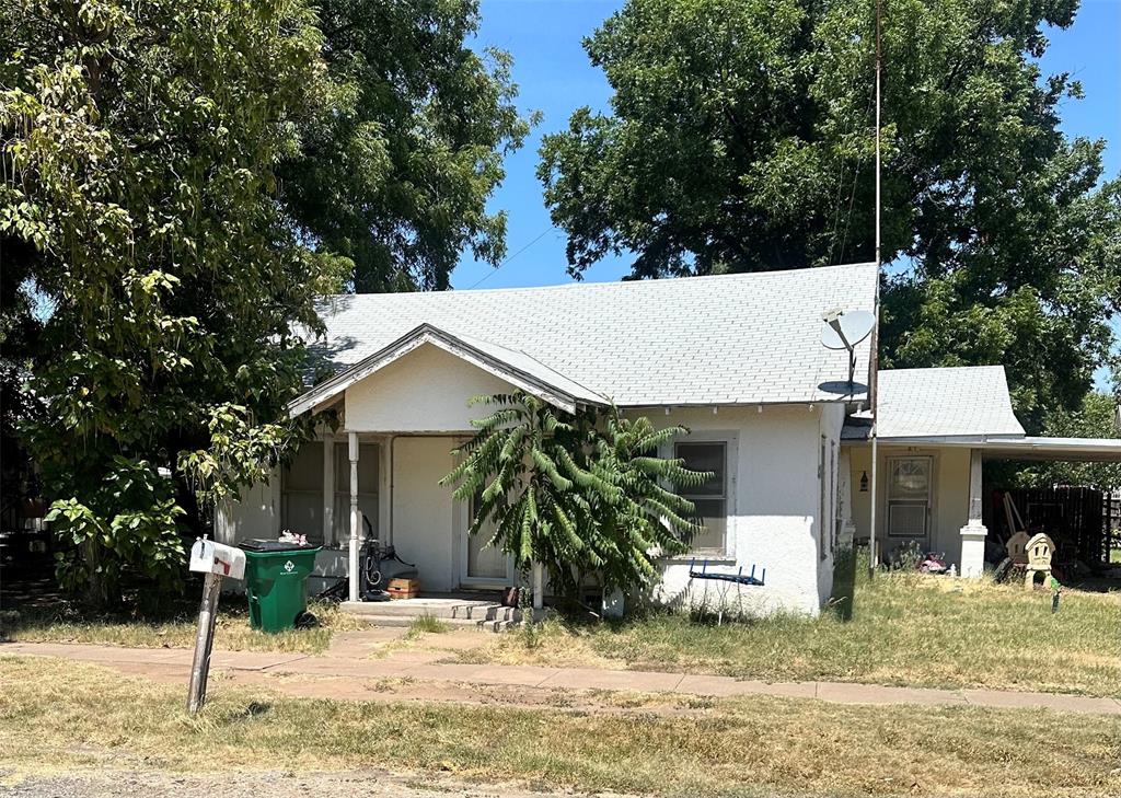 a backyard of a house with yard and garage