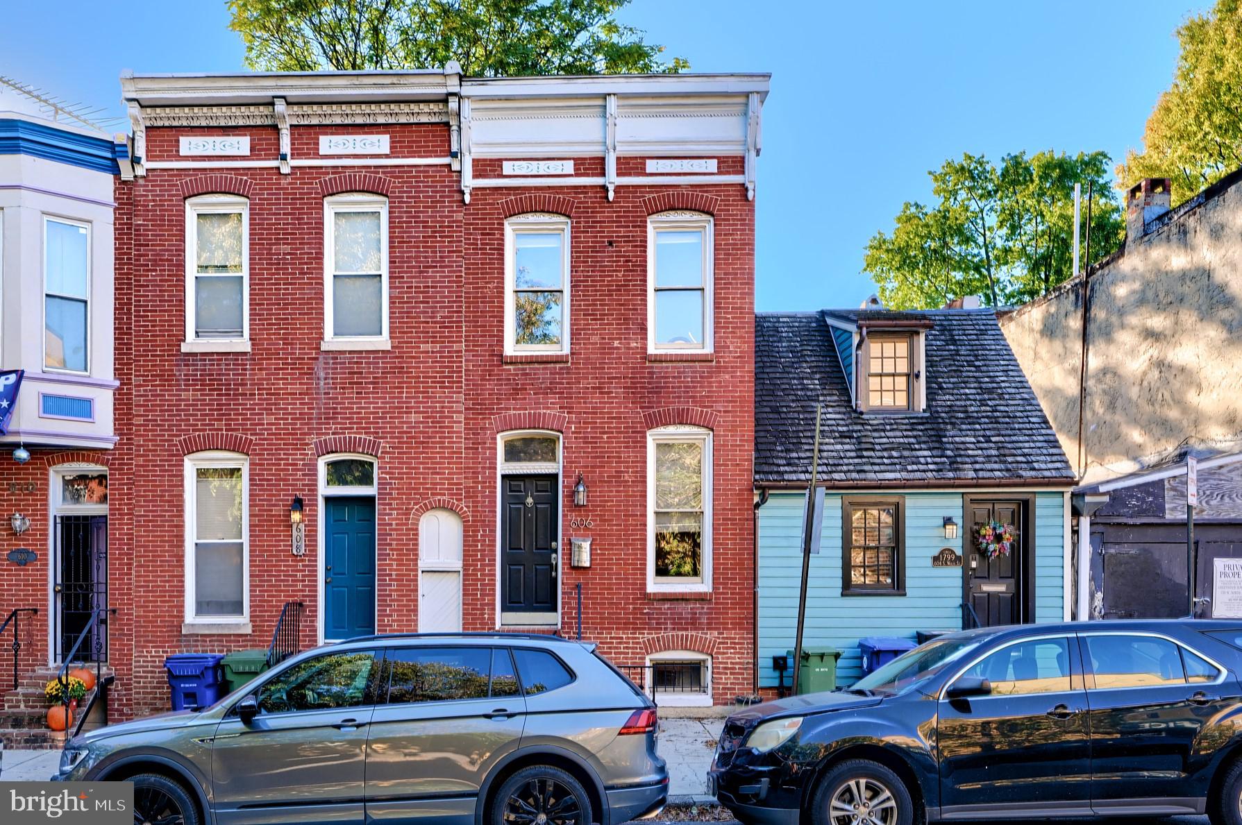 a front view of a house with parking space