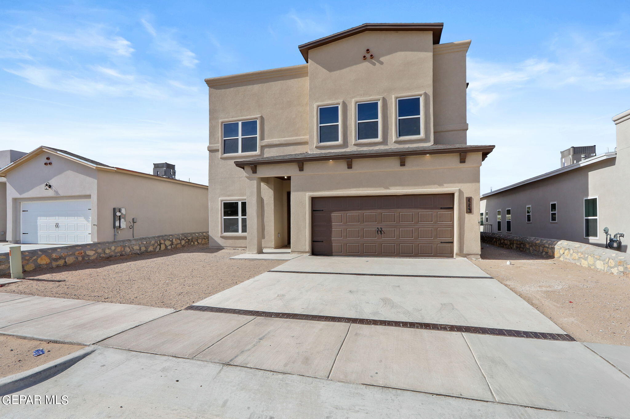 a front view of a house with yard