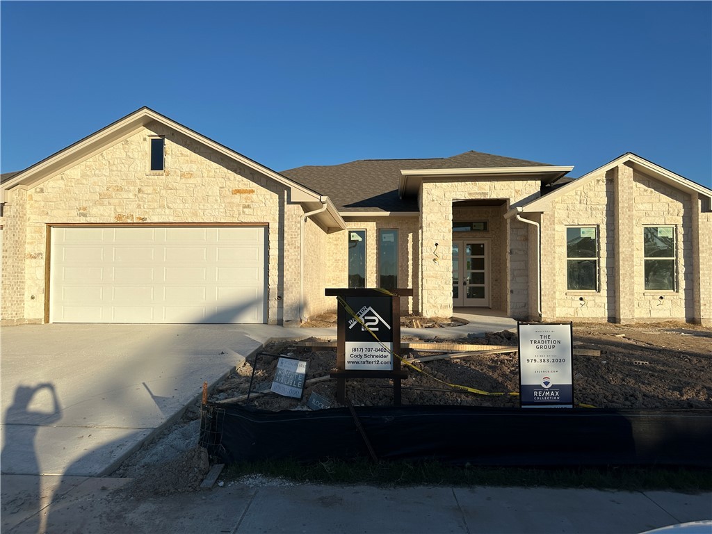 Unfinished property with a garage